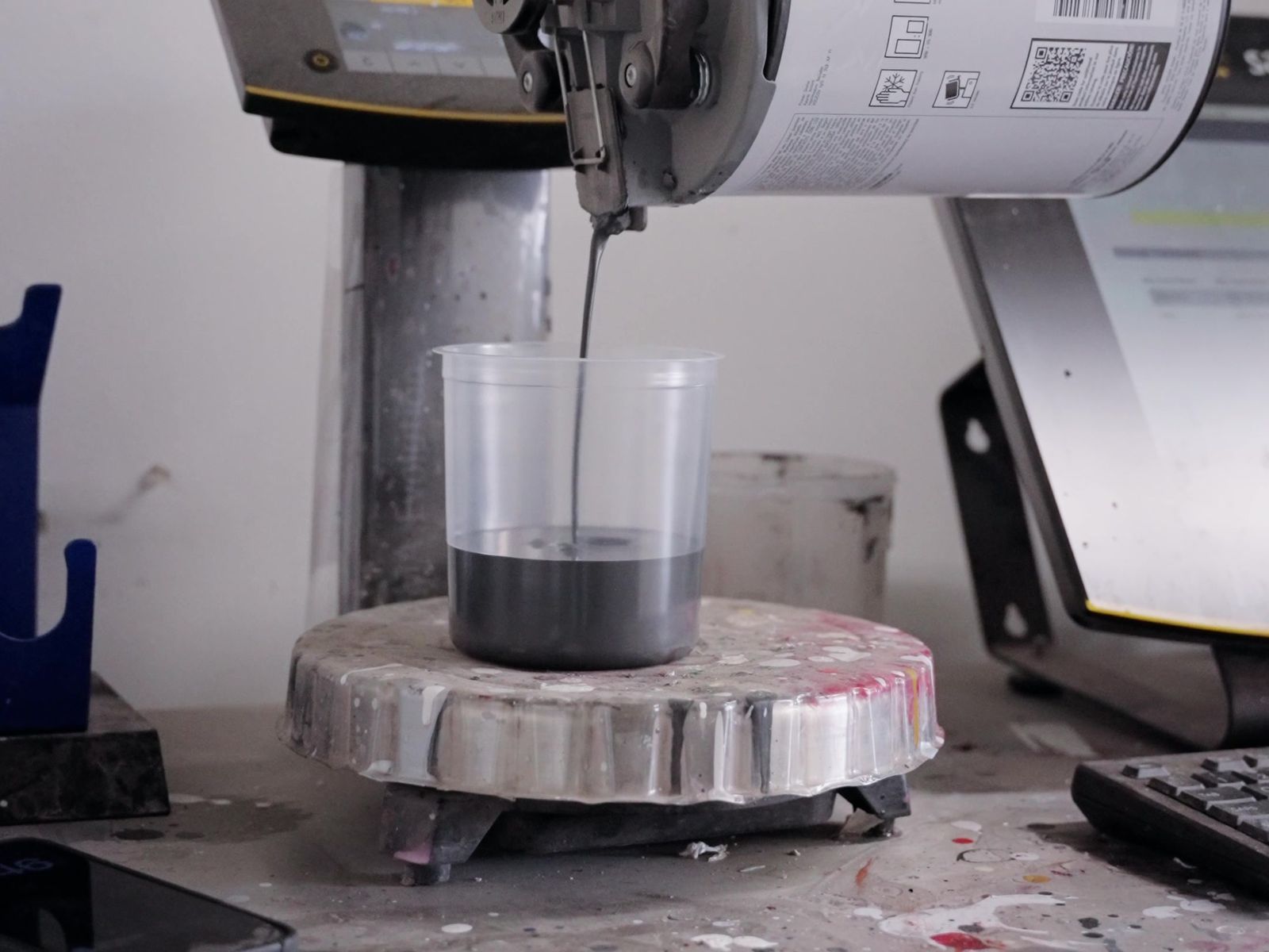 Paint being mixed for a color match